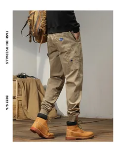 Detailed view of men's Japanese style khaki cargo joggers with elastic cuffs
