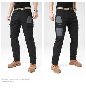 Detailed look at men's outdoor tactical cargo pants with grey contrast pockets.