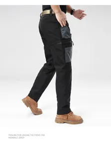 Detail of men's black tactical cargo pants with grey side pockets and durable outdoor fabric