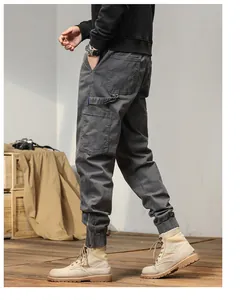 Men's Japanese casual cargo pants with elastic cuffs and side pockets for outdoor style.