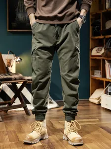 Stylish olive green men's cargo jogger pants in a rugged outdoor mountain fashion style