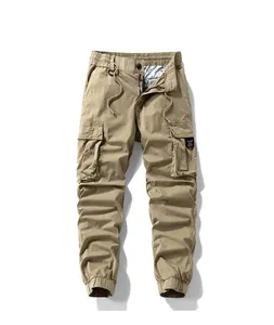 Close-up detail of men's khaki high street cargo joggers with multi-pocket design