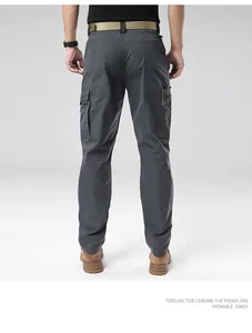 Detailed back view of men's waterproof charcoal outdoor cargo pants with utility pockets
