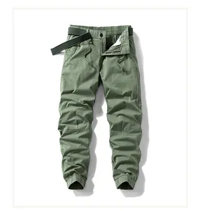 Close-up of olive green men's cargo joggers with matching woven belt detail