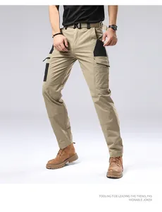 Detail view of men's khaki cargo pants with tactical pockets and belt