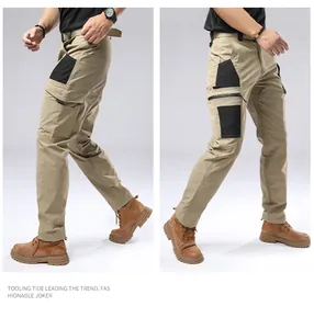 Detail view of khaki tactical cargo pants with multiple pockets for outdoor use.
