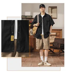 Detailed macro view of men's Japanese style black cargo short sleeve shirt with label
