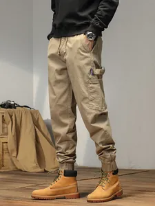 Men's khaki cargo jogger pants with drawstring waist and zip cuffs for casual wear