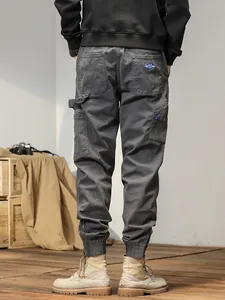 Japanese style dark grey men's cargo joggers with elastic ankle cuffs and side pockets