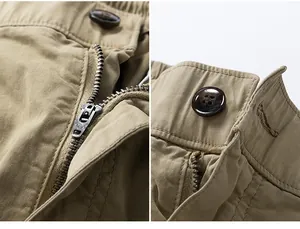 Close-up detail of the durable YKK zipper and button closure on khaki cargo pants