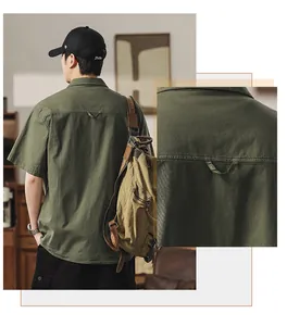 Detailed view of the back yoke and stitching on a vintage Japanese green utility shirt.