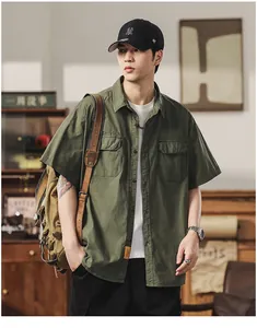 Male model styling a green short-sleeved cargo shirt with vintage decor background
