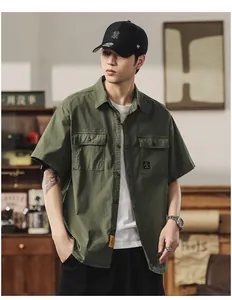 Detailed view of army green short-sleeved cargo shirt on male model in vintage setting