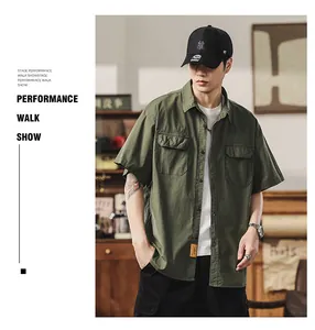 Model wearing a military green short-sleeve Japanese work shirt with double pockets
