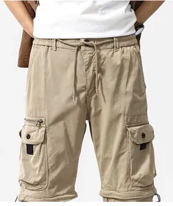Detailweergave van kaki retro cargo broek met elastische taille en grote zakken.