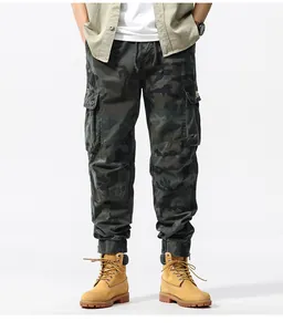 Detailed view of men's camouflage cargo jogger pants featuring large side pockets