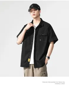 Professional model wearing black short-sleeved cargo shirt and khaki multi-pocket pants