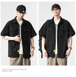 Detail view of men's black short-sleeve work shirt with vintage industrial style pockets