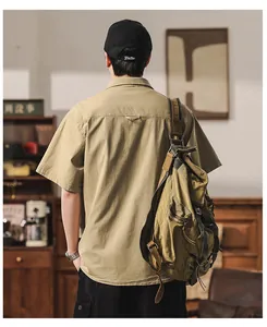 Detailed back view of a men's khaki short sleeve worker cargo shirt in retro style