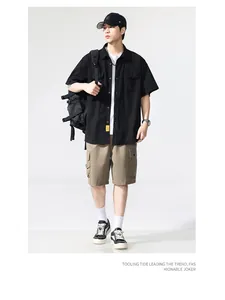 Mens vintage Japanese style short-sleeved black cargo shirt with multi-pocket design detail