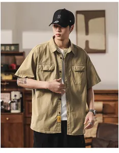 Detailed view of a men's Japanese style khaki cargo short sleeve shirt with pockets