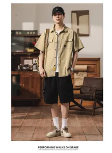 Detailed view of men's retro khaki short-sleeved cargo shirt with multi-pocket design