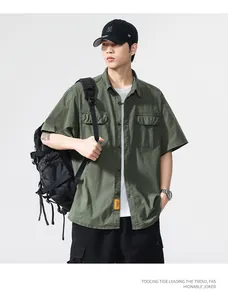 Front view of an Asian male model wearing an olive green short-sleeved cargo shirt.