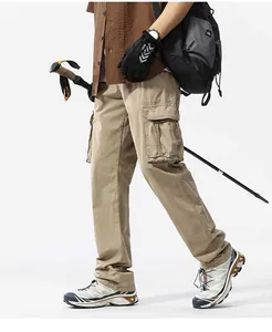 Side view of khaki multi-pocket cargo pants for men in a rugged outdoor style