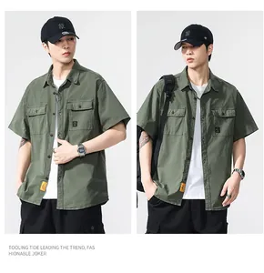 Detailed view of men's vintage green short-sleeve cargo shirt with double pockets