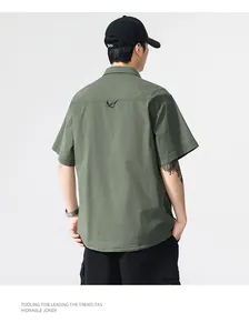 Back view of a men's retro olive green short-sleeved work shirt with casual fit