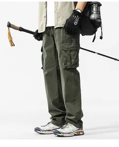 Detail of men's army green cargo pants with multiple utility pockets for outdoor hiking
