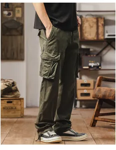 Vintage men's olive green straight-leg cargo pants with multi-pockets on model