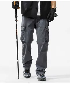 Detailed view of men's heavy duty multi-pocket cargo pants in grey retro style