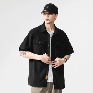 Men's black short-sleeved workwear shirt with dual chest pockets and utility style
