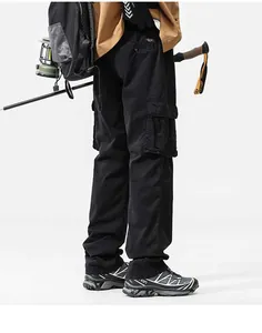 Detailed view of men's retro black cargo pants with multiple side pockets and loose fit