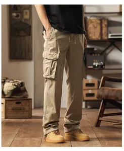 Full view of men's khaki cargo pants with multiple utility pockets in a vintage setting