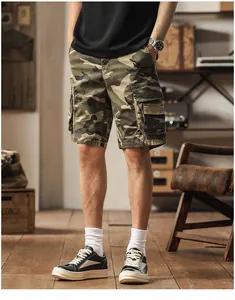 Men's classic camouflage multi-pocket cargo shorts shown in a stylish retro indoor setting