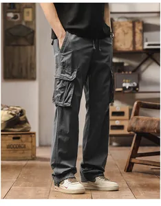 Full-length view of men's loose straight charcoal cargo pants with side pockets