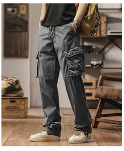 Detail view of men's loose straight-leg cargo pants with multi-pockets
