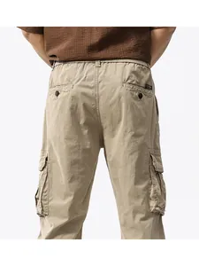 Back view of men's American vintage multi-pocket heavy cargo pants in khaki loose fit style