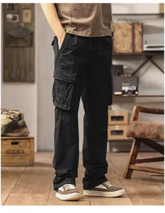 Close-up view of men's loose straight black cargo pants with multi-pockets and drawstring