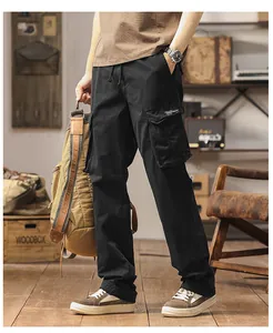 Detailed view of black men's loose cargo pants featuring functional multi-pocket design