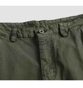 Close-up detail of olive green men's cargo pants featuring button and belt loops.