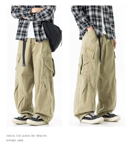 Detail view of khaki men's straight-leg cargo pants with multi-pocket streetwear design.