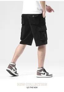 Detail of black multi-pocket cargo shorts for men with loose casual fit