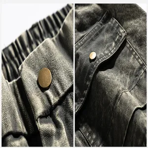 Macro detail of distressed techwear cargo pants showing button and fabric texture