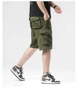 Detail view of olive green cargo shorts featuring multiple large utility pockets on the side