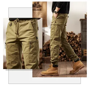 Detail view of men's vintage khaki cargo pants with multiple tactical pockets and drawstring