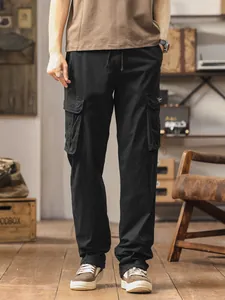 Professional studio shot of men's loose fit straight-leg black cargo pants with multi-pockets