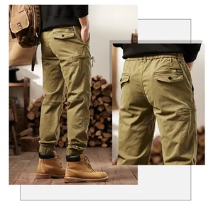 Detail view of American retro multi-pocket cargo pants in a rustic outdoor setting